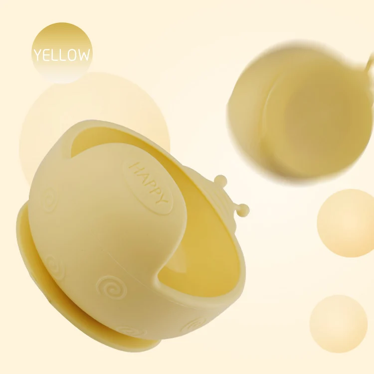 Grey snail-shaped silicone feeding bowl placed on a table