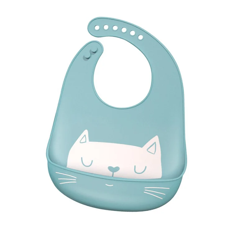 Silicone baby bib in blue, folded flat for storage in a nappy bag