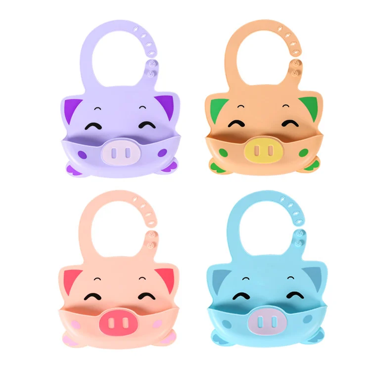 Silicone baby bib folded flat for storage in a nappy bag