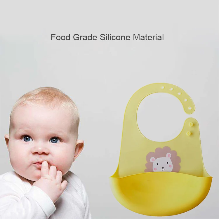 Silicone baby bib in use on a toddler, showing fit and pocket function