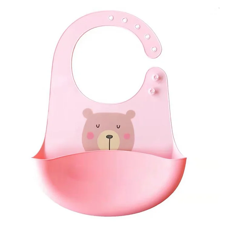 Green silicone baby bib with rolled-up side showing flexibility
