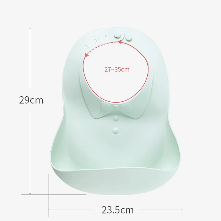 Multiple foldable silicone baby bibs in different colours laid out on a table