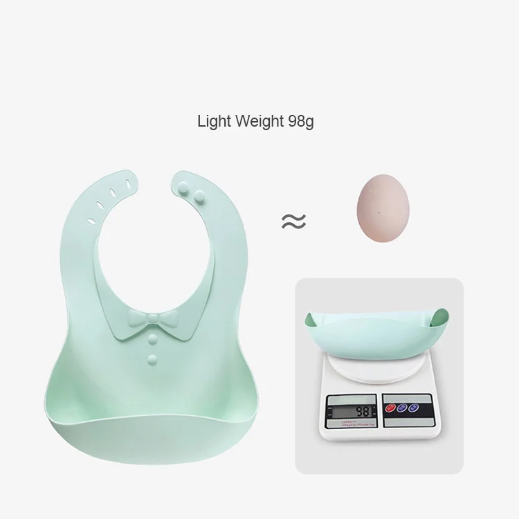 Side view of a foldable silicone baby bib showing thickness and flexibility