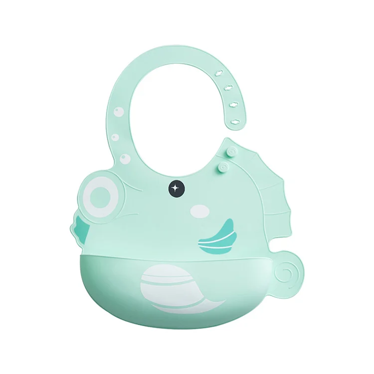 Blue seahorse-shaped silicone bib laid flat, showing the front and adjustable buttons