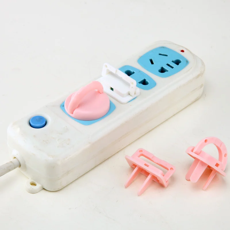White plastic retractable EU socket cover protector installed on a 3-pin socket