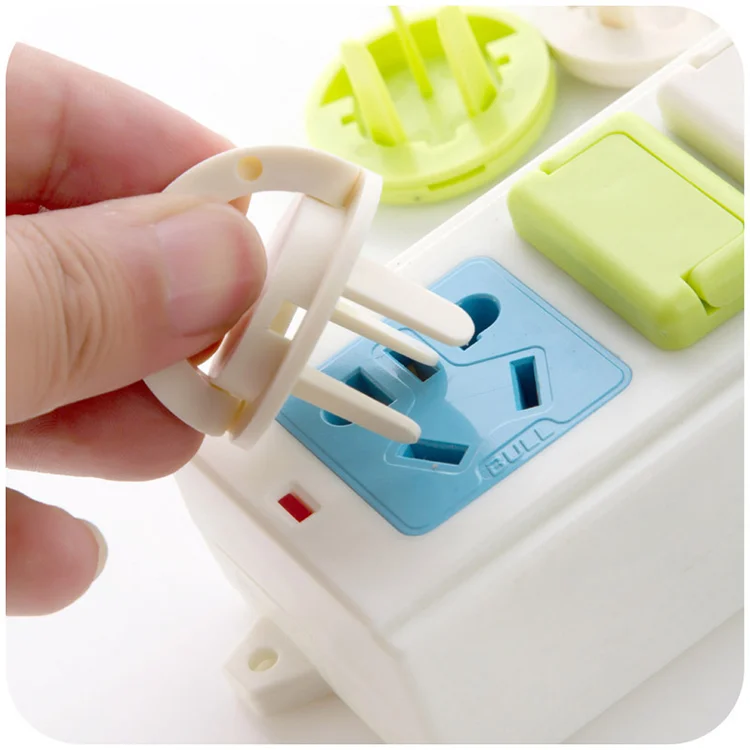 Green plastic retractable EU socket cover protector with twist mechanism