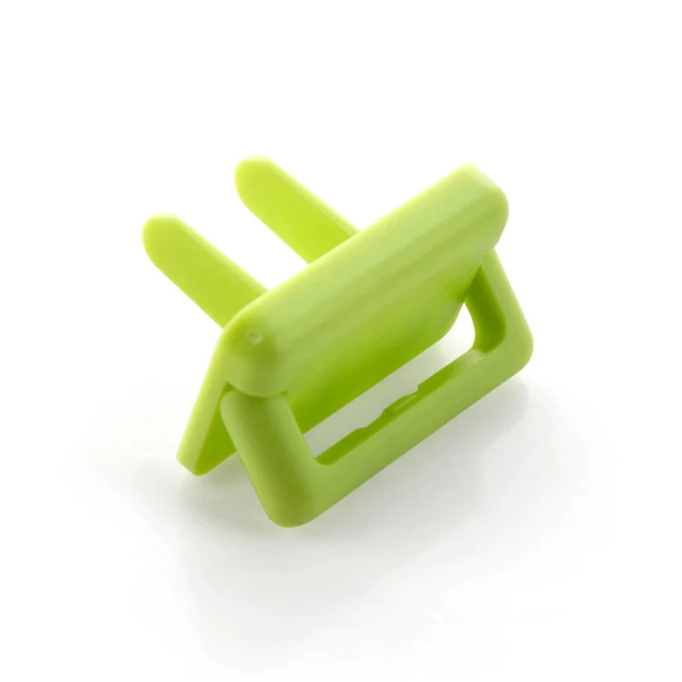 Pink plastic retractable EU socket cover protector with twist mechanism shown in detail