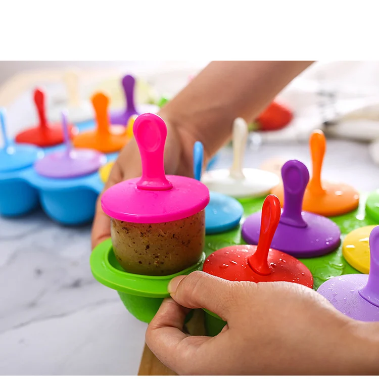 9-cup silicone mold with lid removed, showing rounded cubes