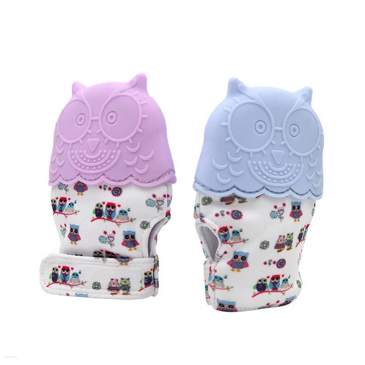 Pink silicone teething glove with sound film, hand-shaped, standing upright
