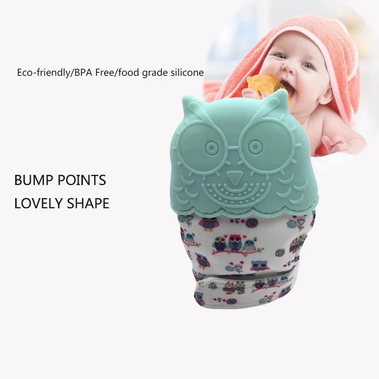 Silicone teething glove with sound film, showing the adjustable anti-shedding hook