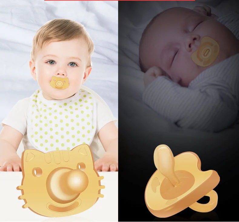 Pacifier with clip and storage box laid out on a white surface