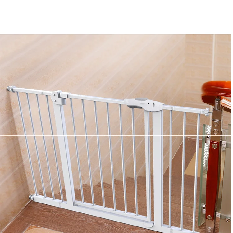 White retractable mesh safety gate installed in a doorway, fully open with hold-open feature engaged