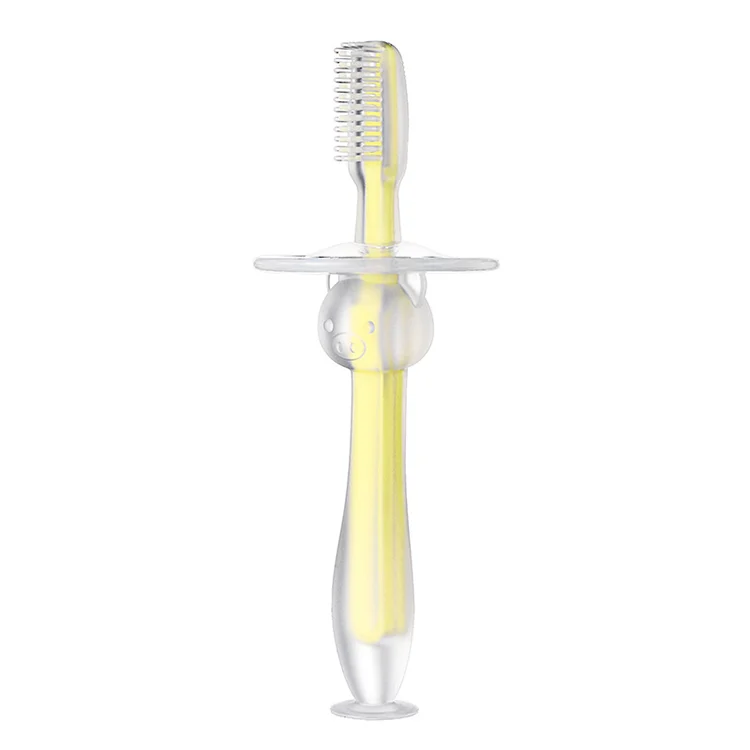 Green baby toothbrush with safety cover and suction cup