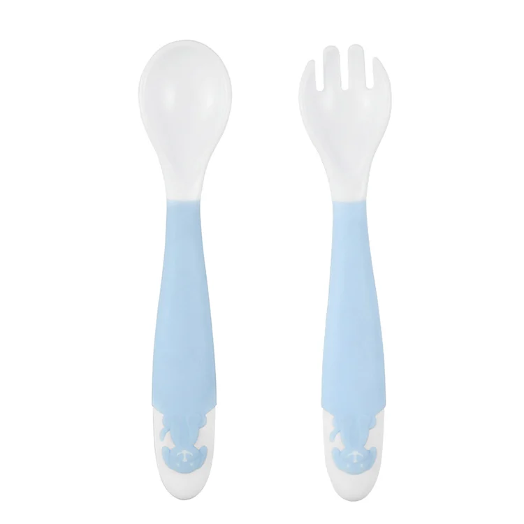 Pink bendable baby spoon and fork set with soft TPE tips, standing upright