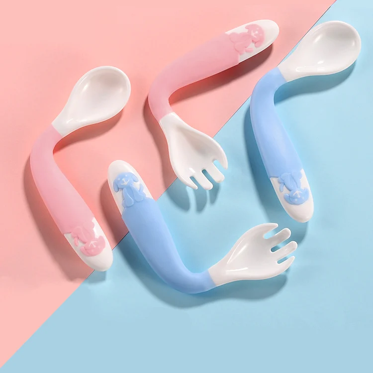 Green baby spoon and fork set with TPE-coated tips, close-up of soft edges