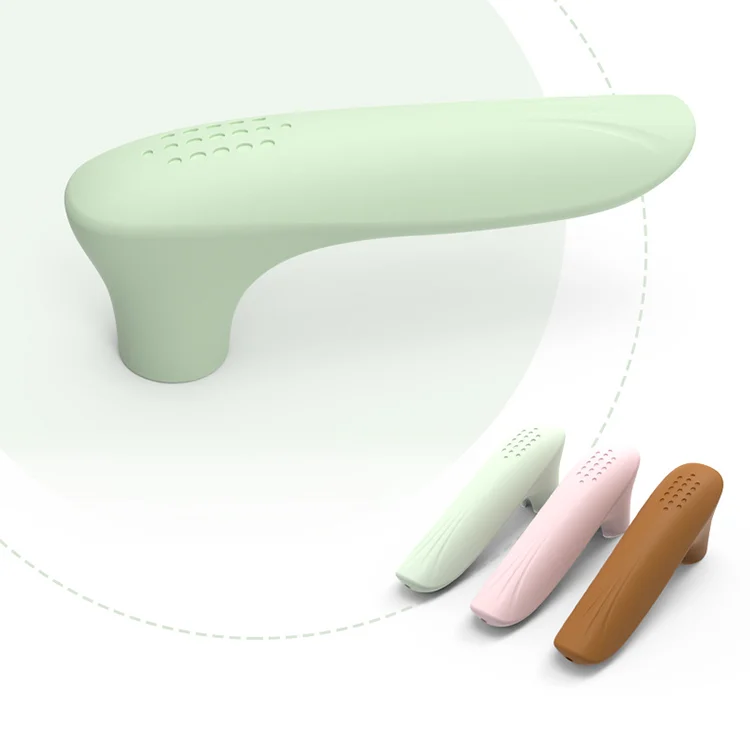 Soft silicone door handle protector installed on a white door handle