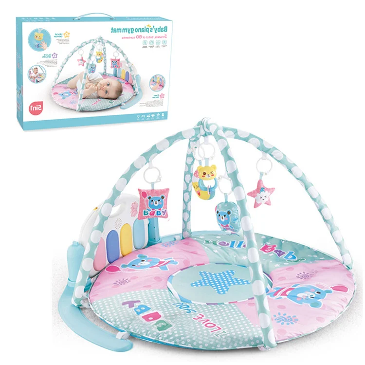 Baby gym mat with four animal-shaped rattle pendants and a mirror on the bubble pillar