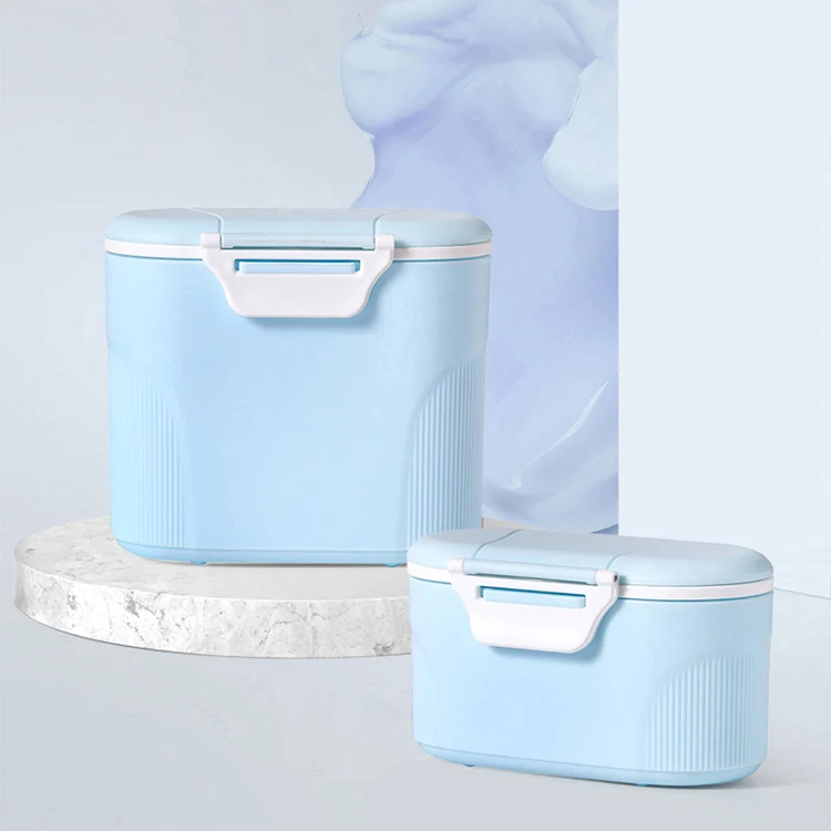 Green 280ml milk powder container with lid removed, showing the internal scoop and scraper