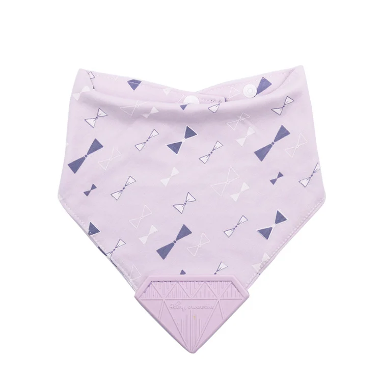 Blue cotton bandana bib with integrated silicone teether, laid flat