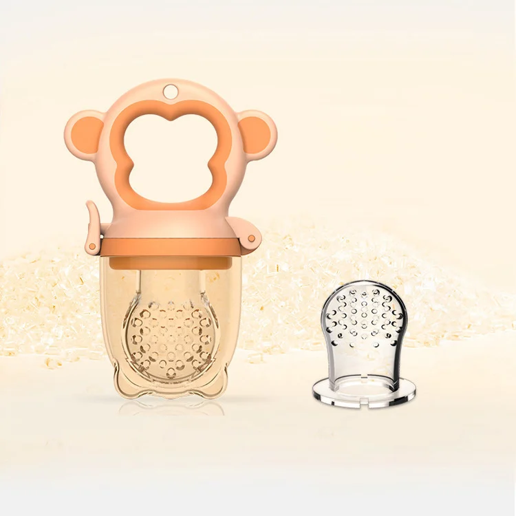 Grey fruit feeder pacifier with the mesh open, showing the interior cavity