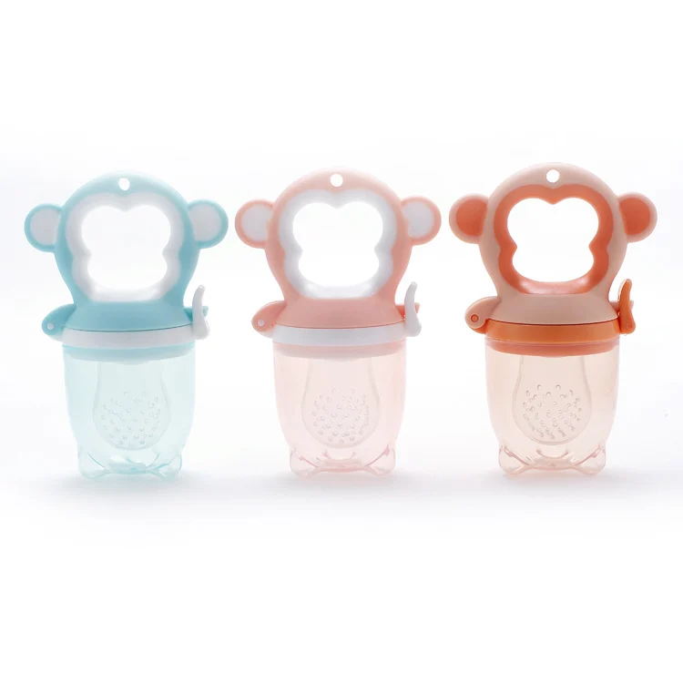 Pink monkey-shaped fruit feeder pacifier with a large mesh and pacifier teat