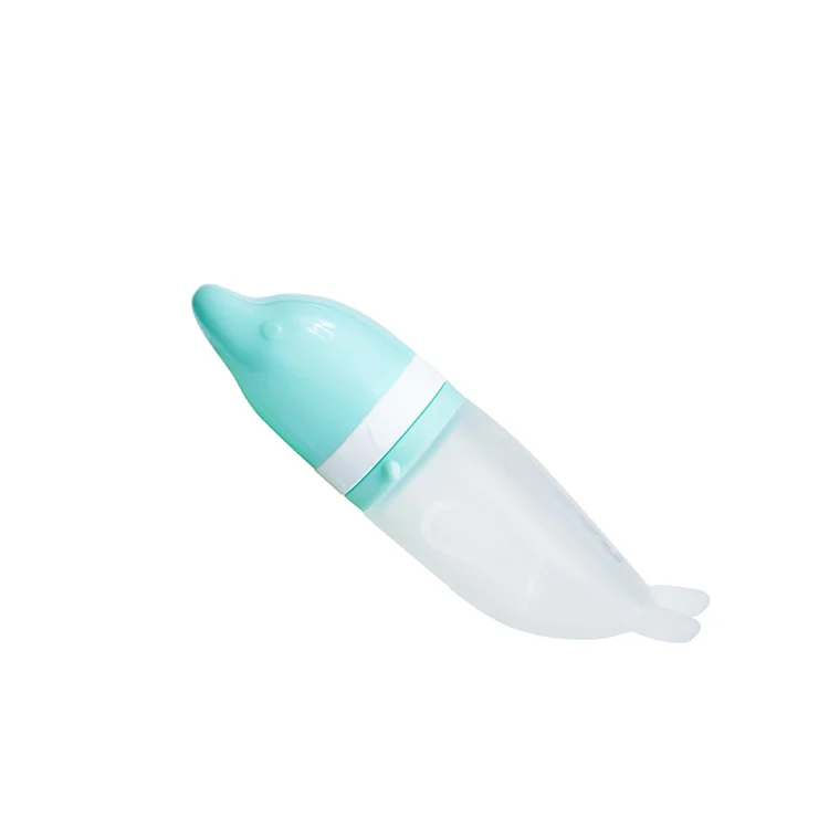 Green silicone feeding spoon with the mesh bag closed and snapped shut