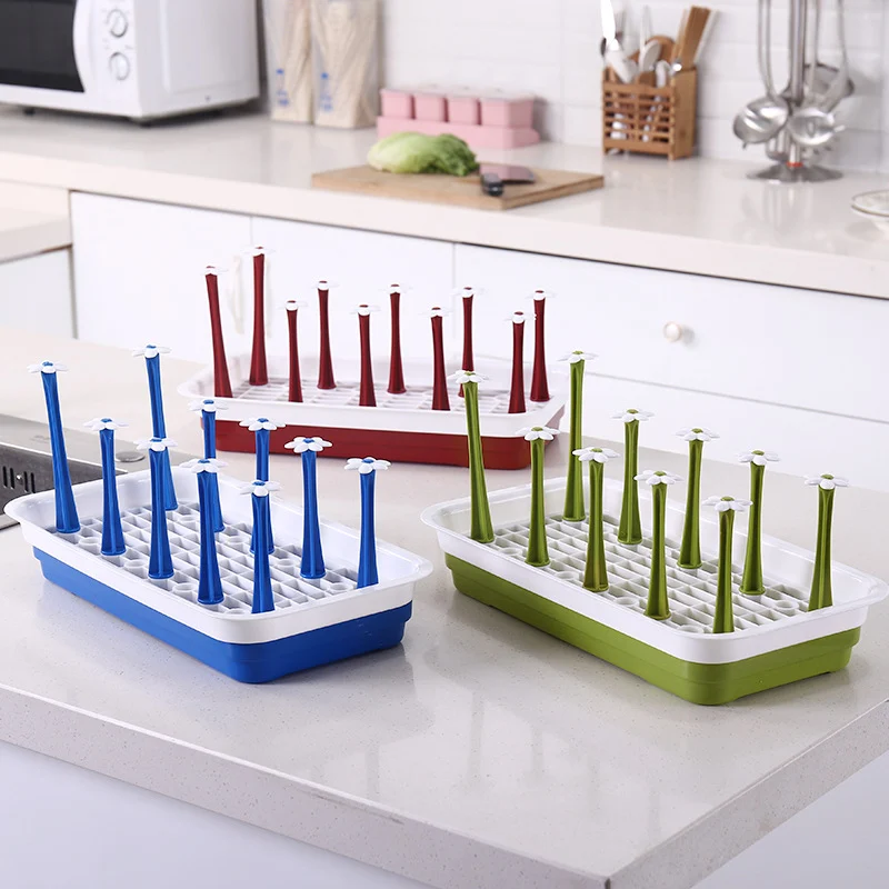 Baby bottle drying rack with the lid removed, showing the deep walls and rounded corners