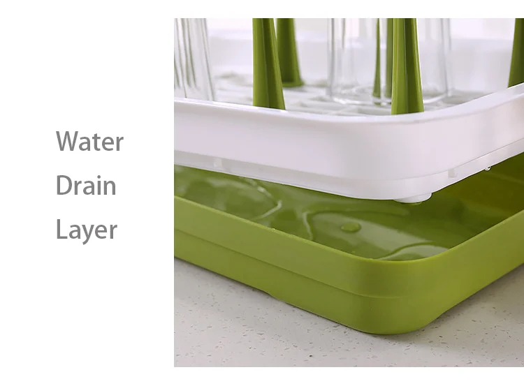 Baby bottle drying rack with water being poured out from the central hole
