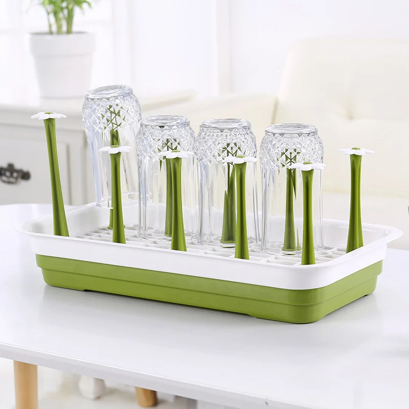 Baby bottle drying rack with a close-up of the rounded corner and drainage feature