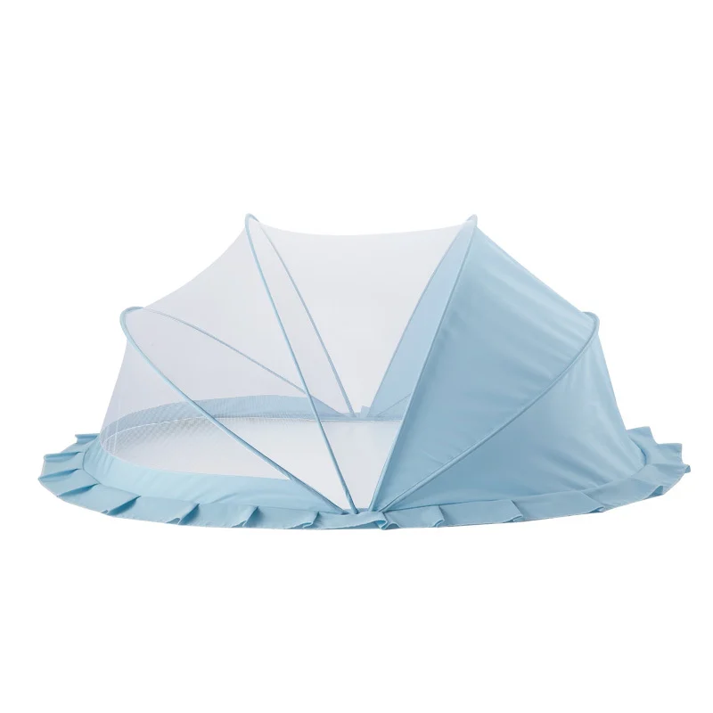 Foldable baby mosquito net canopy in pink, shown open and placed over a baby carrier
