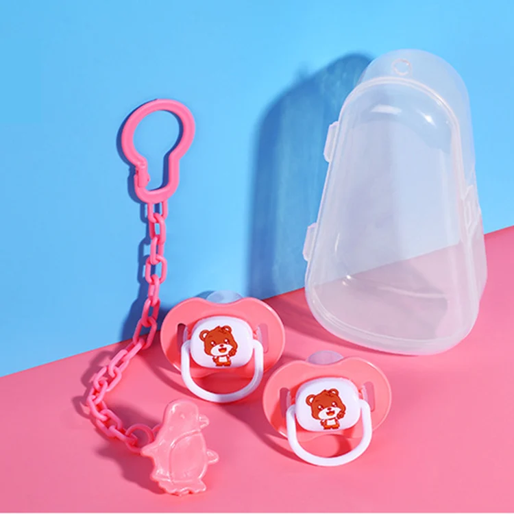 Green pacifier with silicone nipple and ABS/PP clip in close-up