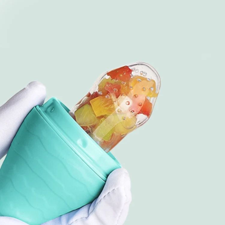 Baby fruit feeder pacifier with anti-slip handle, front view with open pouch