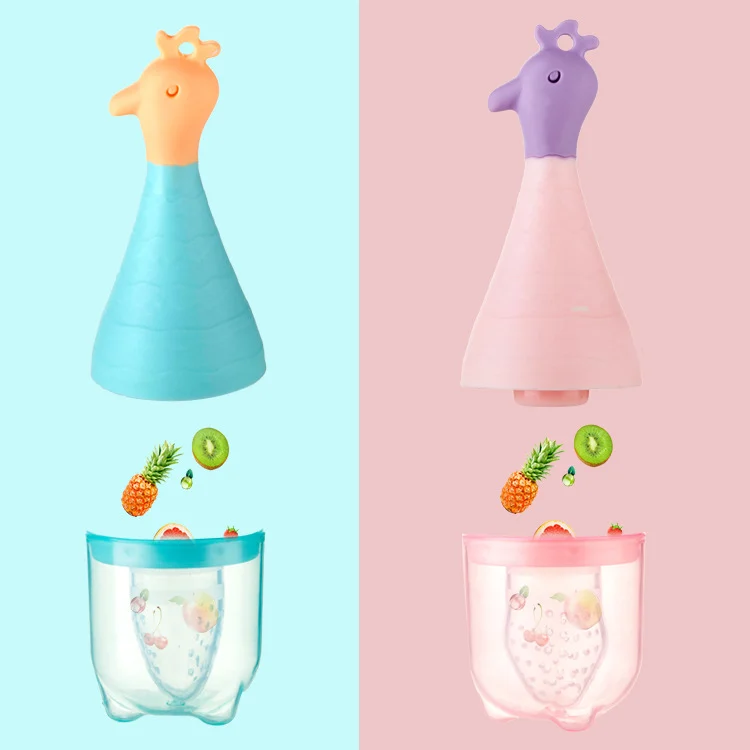Baby fruit feeder pacifier with anti-slip handle, placed on a clean surface