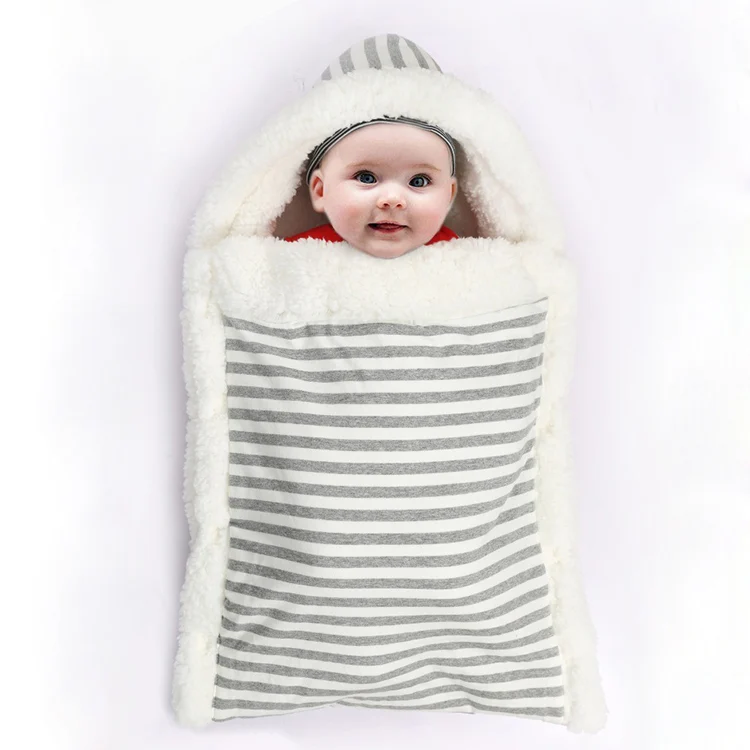 Pink stroller wrap sleeping bag laid flat, showing snap button closure