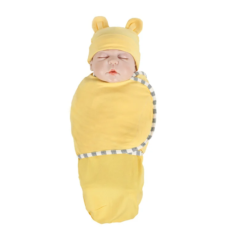 Green cotton stretchy baby swaddle blanket with hat, showing the knitted texture