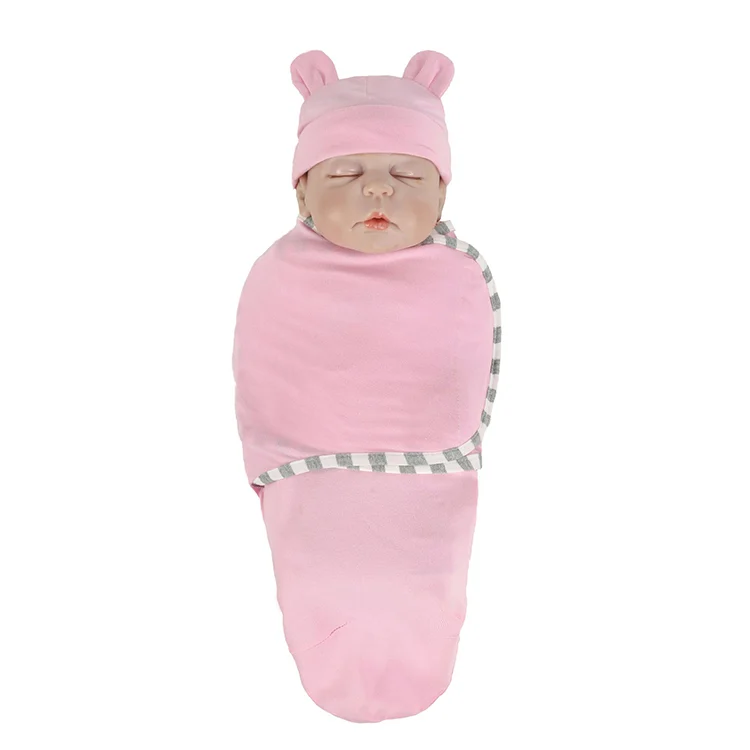 Red cotton stretchy baby swaddle blanket with hat, folded in an OPP bag