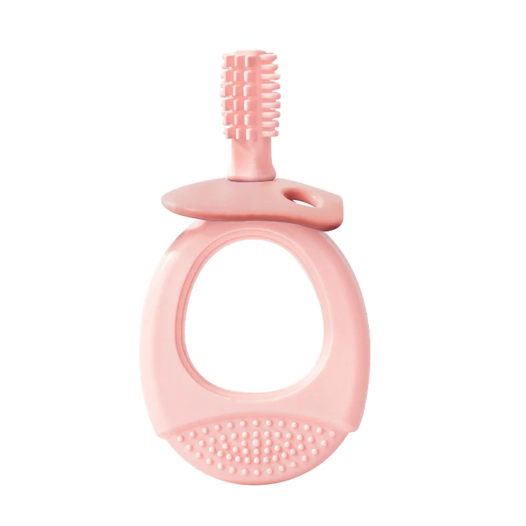Teether toothbrush held in a baby's hand
