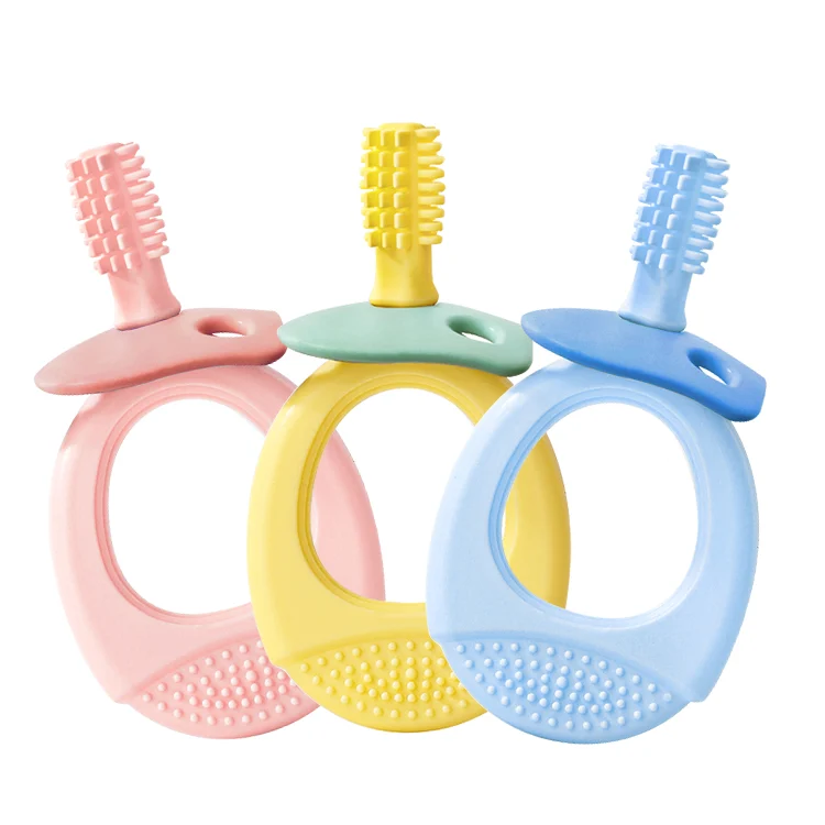 Silicone teether toothbrush with integrated brush head, standing upright