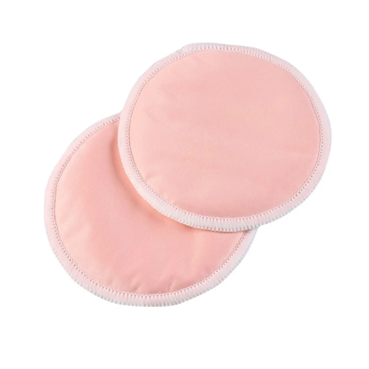 Nursing pad placed inside a nursing bra for discreet fit