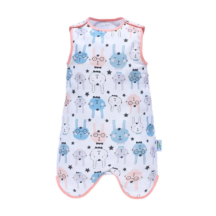 Green baby sleeping bag laid flat, showing snap closure and fabric texture
