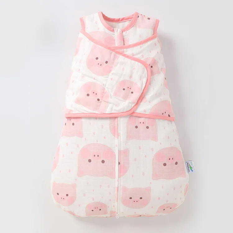Green 100% cotton newborn sleeping bag with zipper closed, lying flat