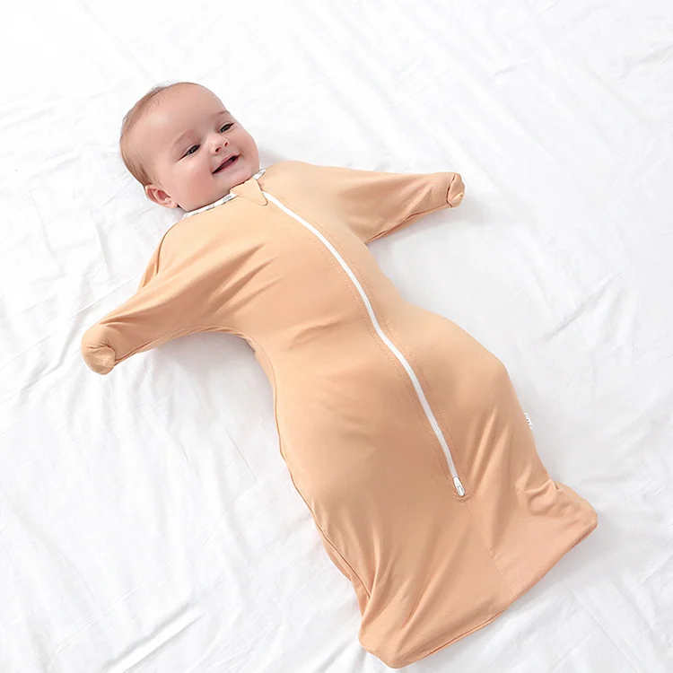 Blue 2-way zipper bamboo cotton sleeping bag standing upright with arms up