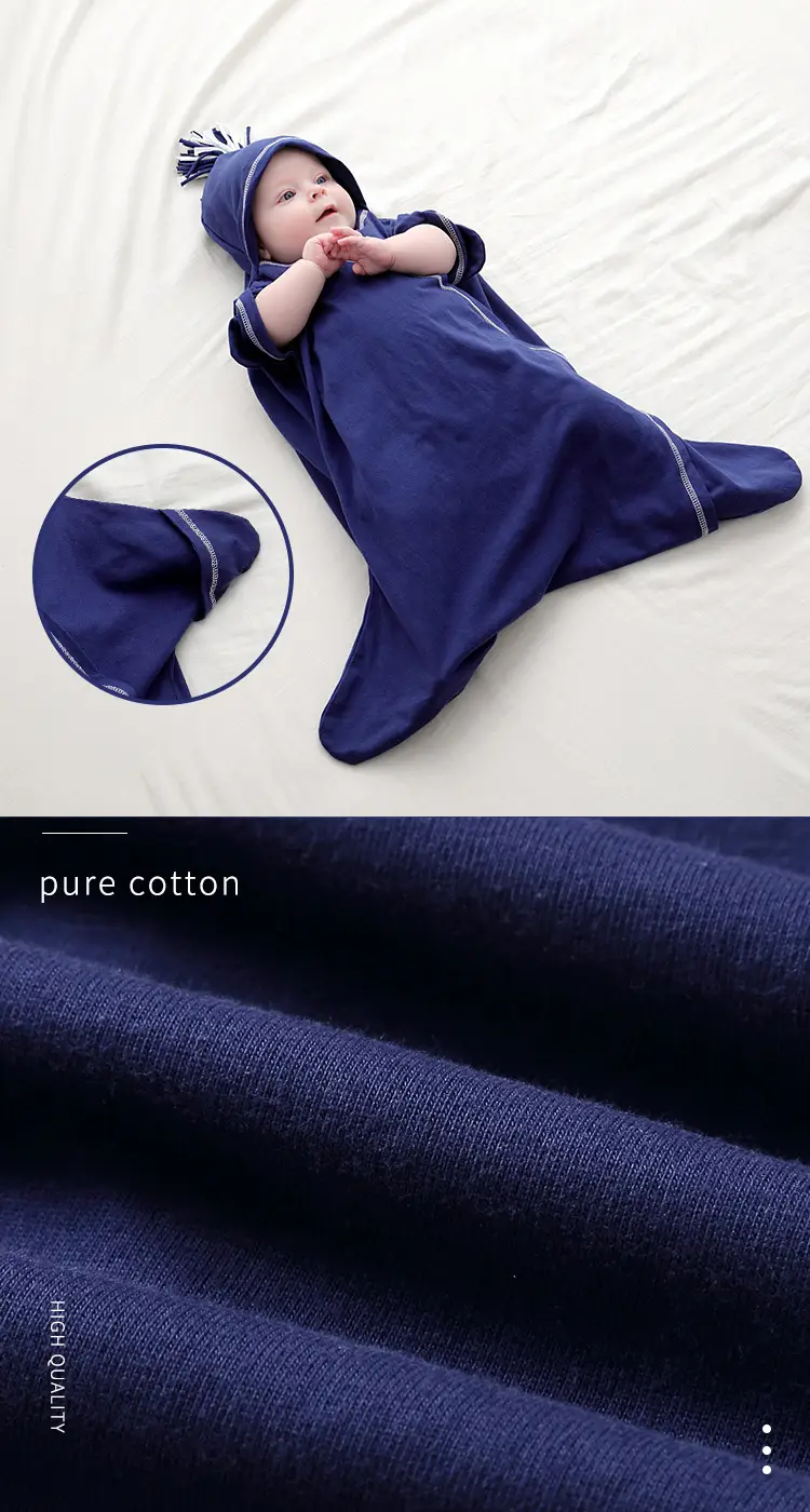 Green star-shaped baby sleep bag with the lace-up open, showing the inside fabric