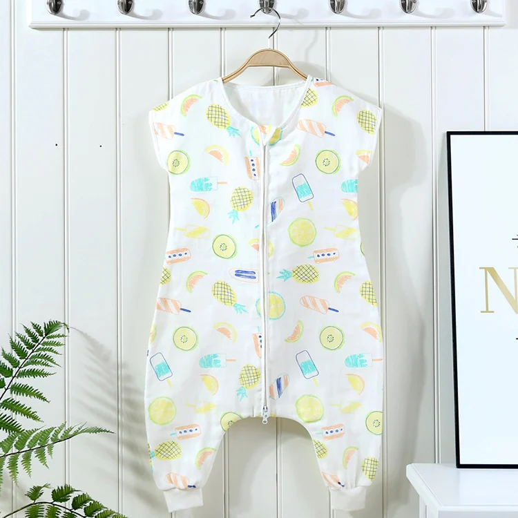 Green baby sleeping bag with the zipper open from the top and bottom