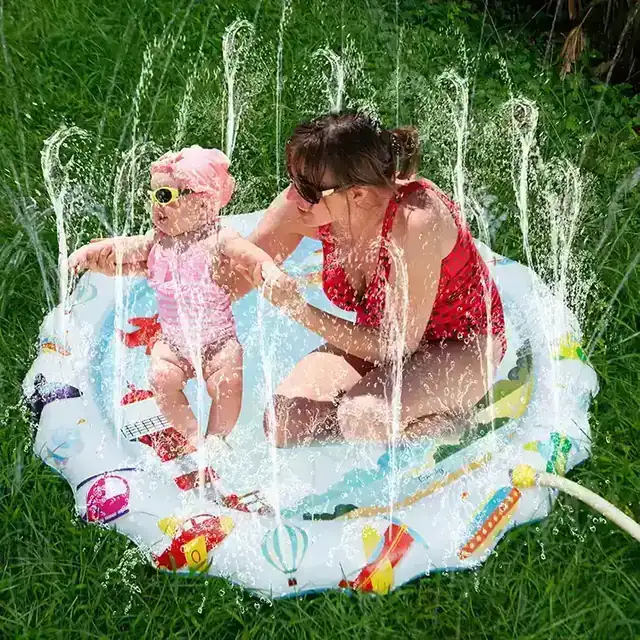 Blue ocean fish mat with the garden hose connected and water flowing