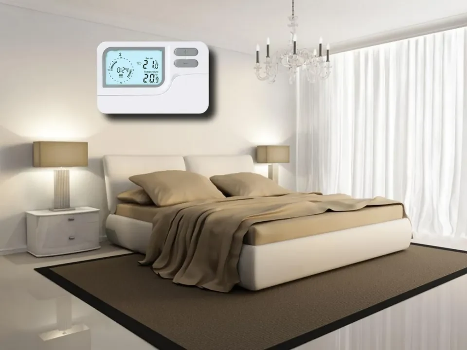 S2303 programmable thermostat mounted in a bedroom