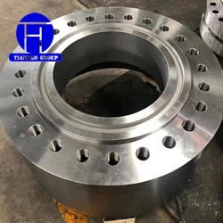 Large machined forged steel flange with drilled bolt holes