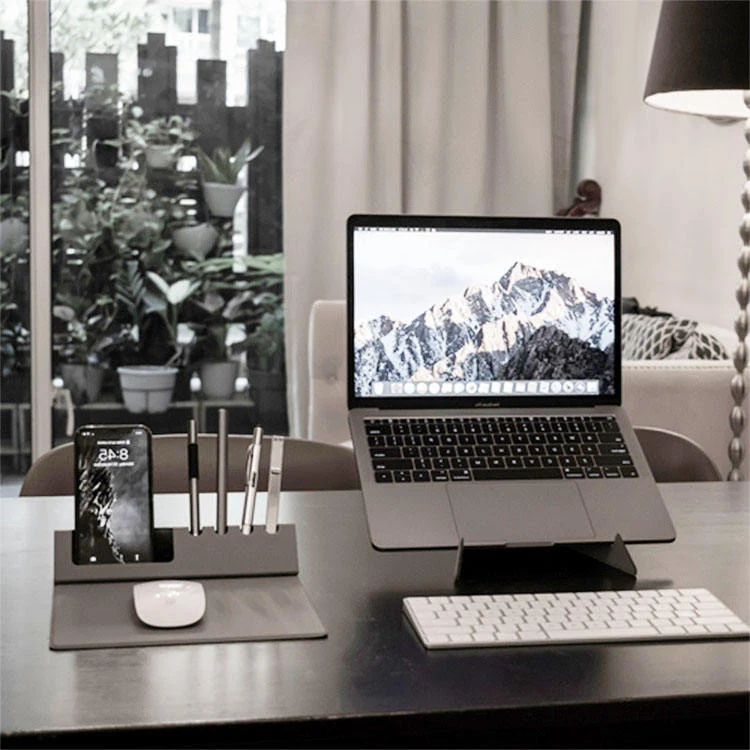 Four-slot pen holder section of the desk mat