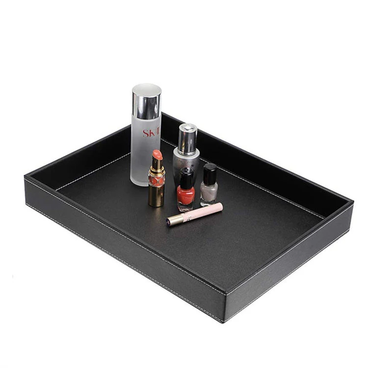 Storage tray holding stationery on an office desk