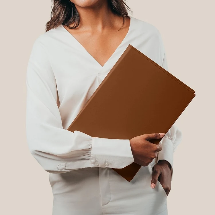 Stack of brown leather menu folders